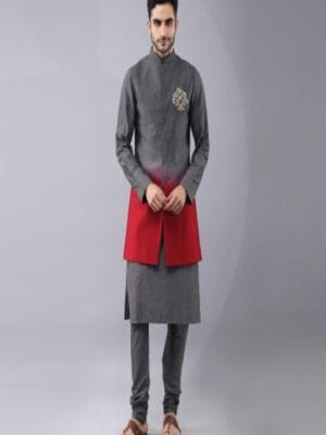 Shaded Bundi Jacket with Placement hand embroidery. It is paired with self dori work kurta and churidaar pyjama.