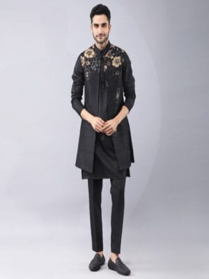 Placement printed Bundi Jacket with hand embroidery, It is paired with kurta (self dori work on collar, placket and cuffs) and pants.